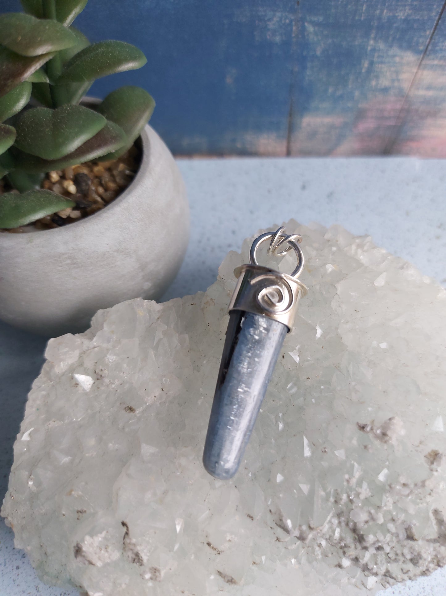 kyanite point with spiral pendant