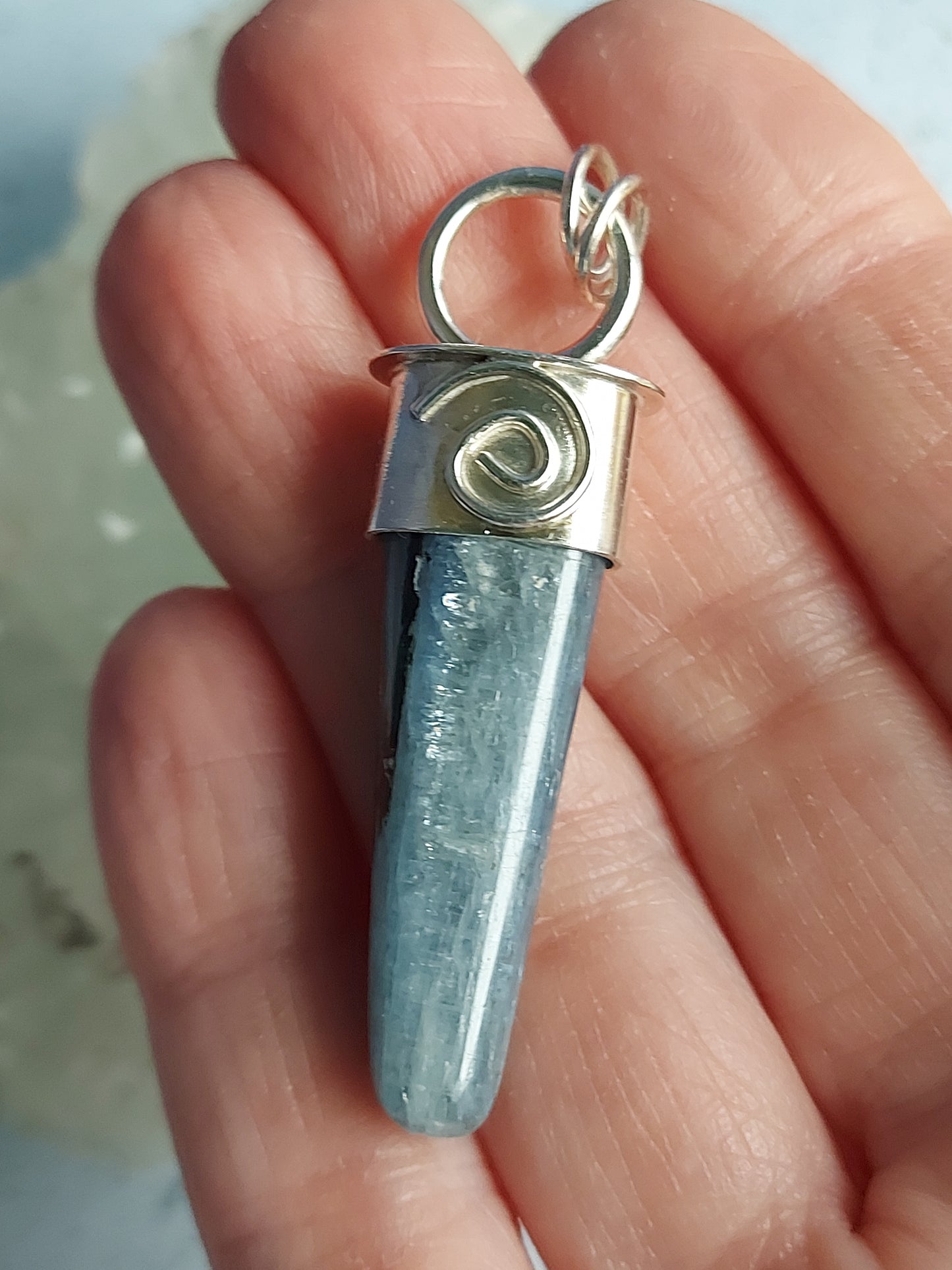 kyanite point with spiral pendant