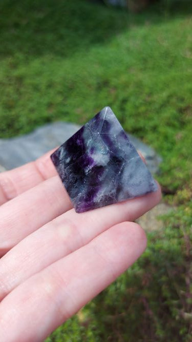 rainbow ,blue, and purple fluorite pyramid