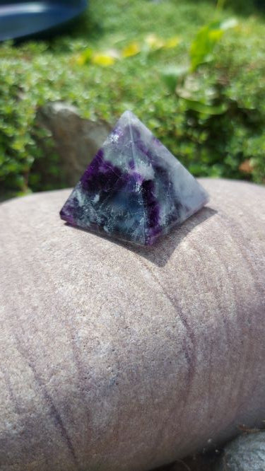 rainbow ,blue, and purple fluorite pyramid